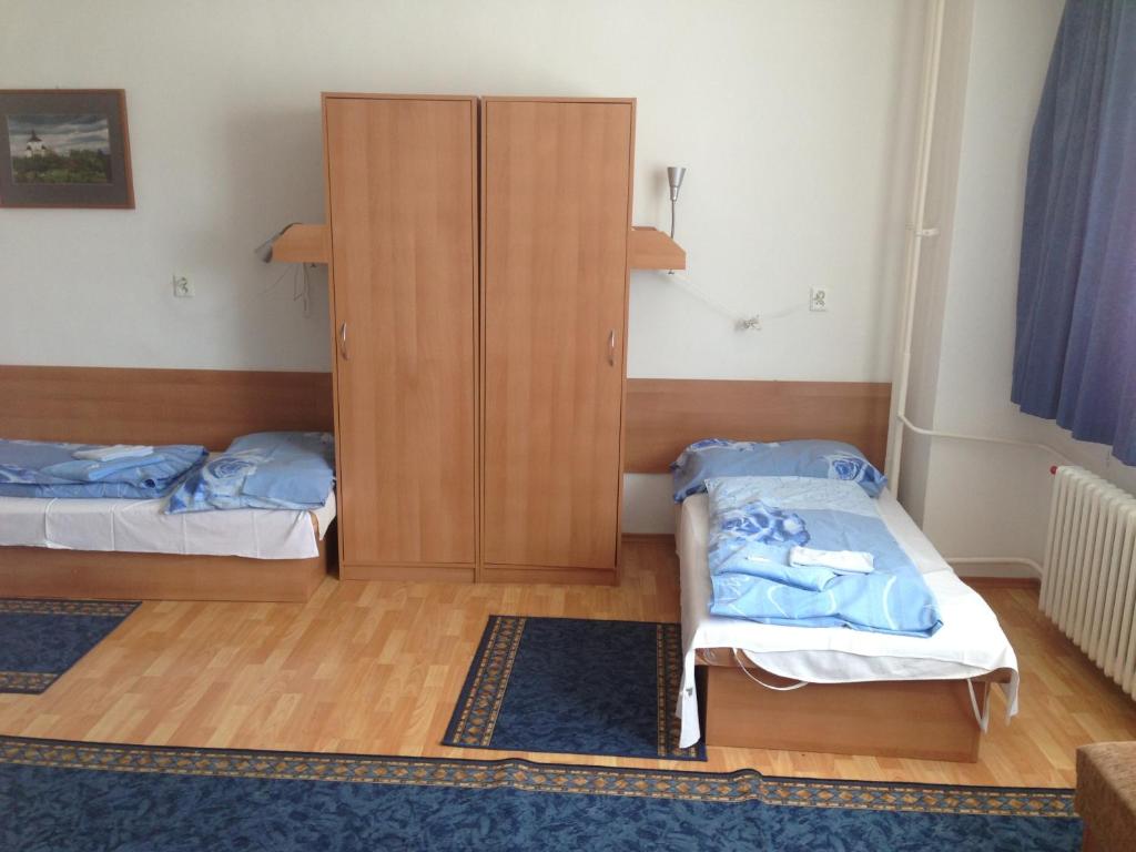 Postel nebo postele na pokoji v ubytování Hotel Prim