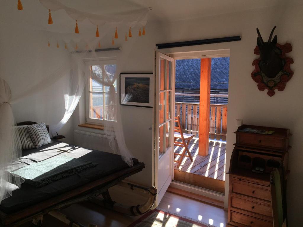 a room with a door leading to a balcony with a deck at KU:L Apartment 4pers. Planai Dachstein in Öblarn