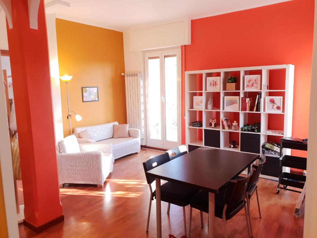 a living room with a table and a couch at Pigneto Suite appartamento 50m da metro C in Rome