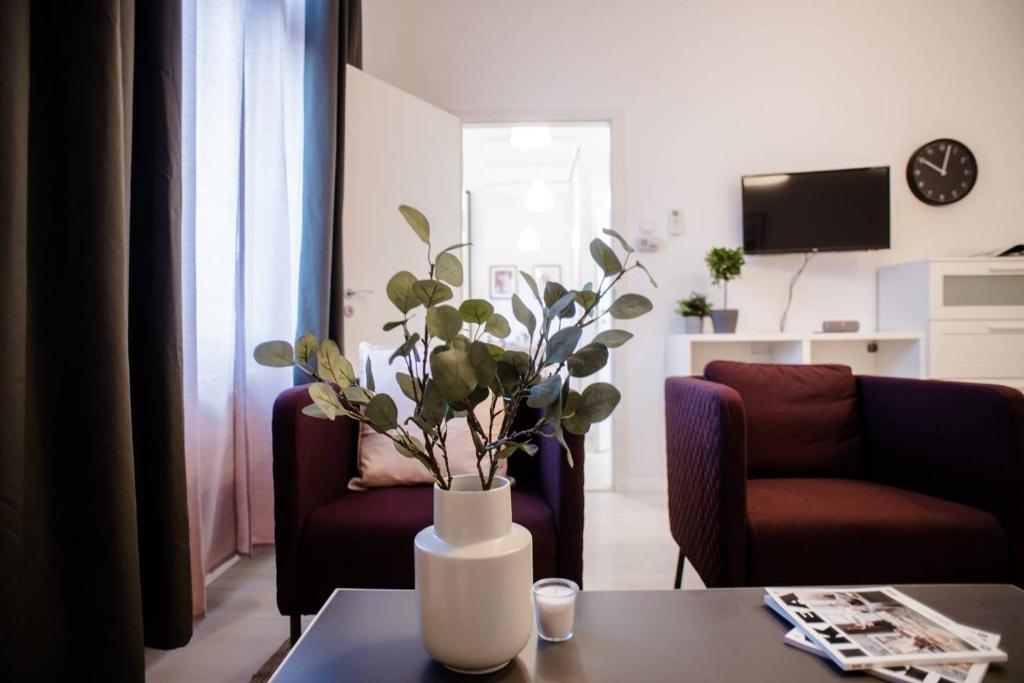 Televízia a/alebo spoločenská miestnosť v ubytovaní Very central, new and comfy apartment with A/C