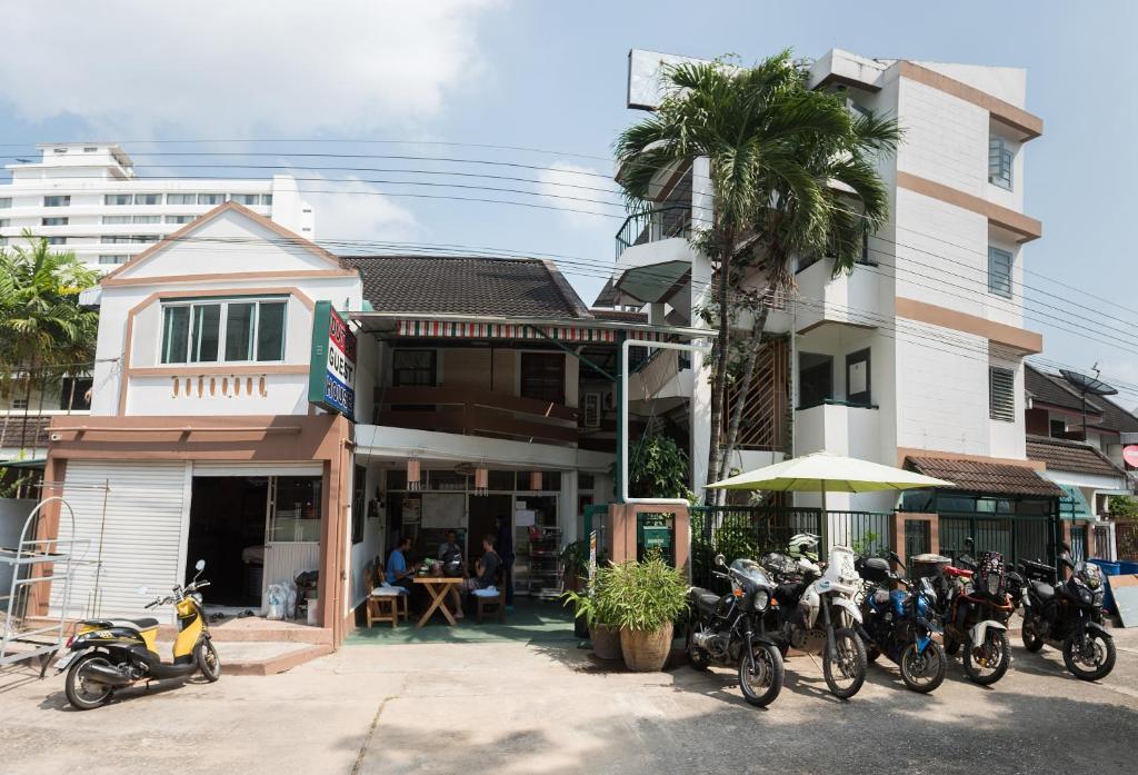 a group of motorcycles parked in front of a building at Dutch Guest House in Chiang Mai