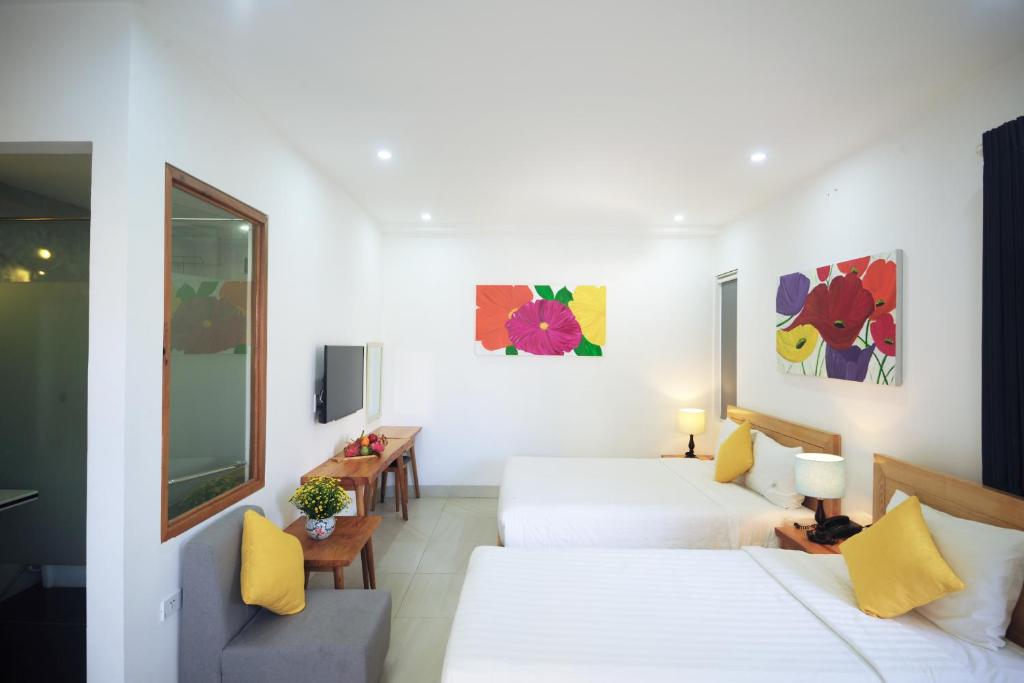 Postel nebo postele na pokoji v ubytování Cavilla Boutique Hotel & Apartment Da Nang
