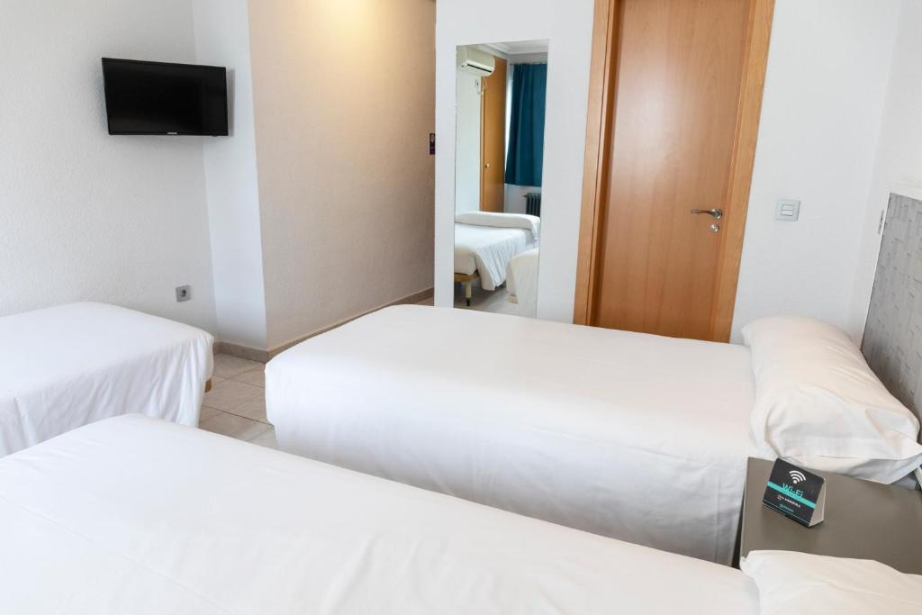 Postel nebo postele na pokoji v ubytování Hotel Alda Centro Palencia