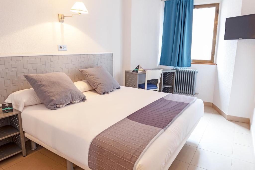 Postel nebo postele na pokoji v ubytování Hotel Alda Centro Palencia