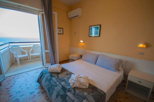Postel nebo postele na pokoji v ubytování Hotel David