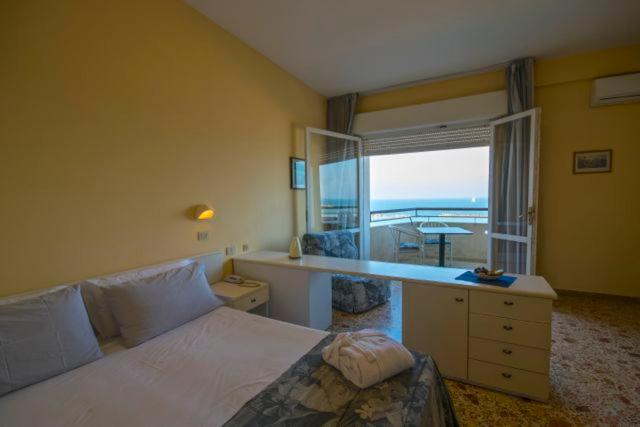 Postel nebo postele na pokoji v ubytování Hotel David