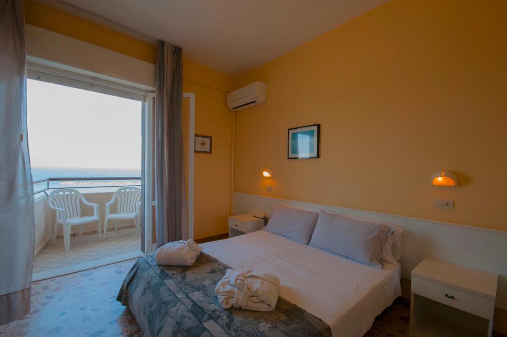 Postel nebo postele na pokoji v ubytování Hotel David