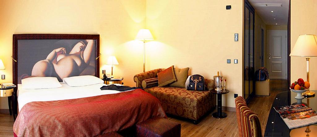 Postel nebo postele na pokoji v ubytování Parc Hotel Flora S