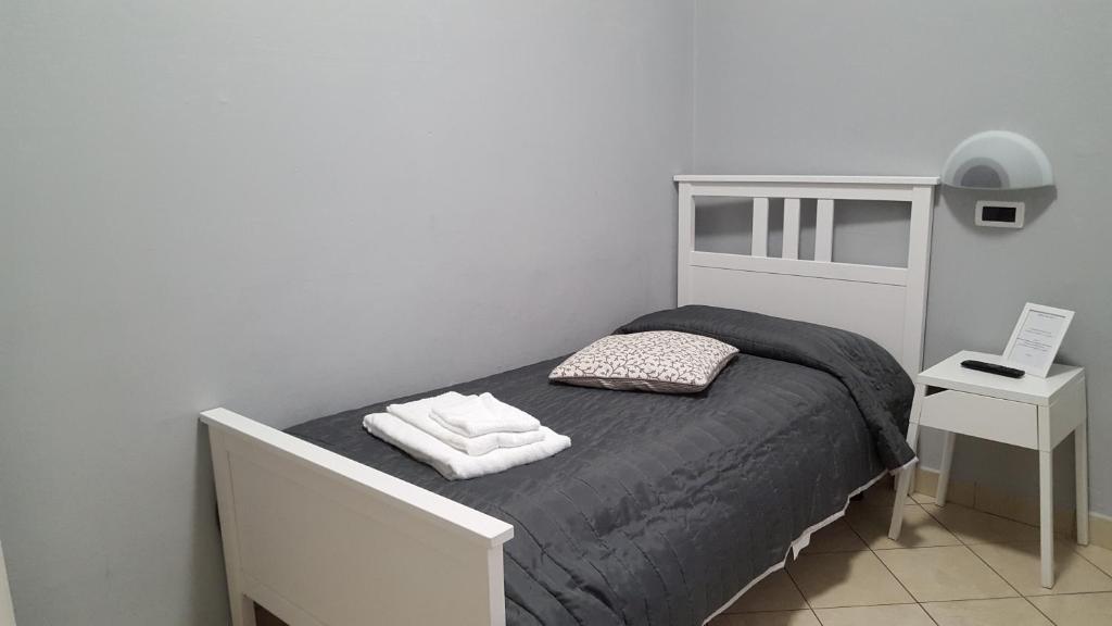 Postel nebo postele na pokoji v ubytování Hotel Milano