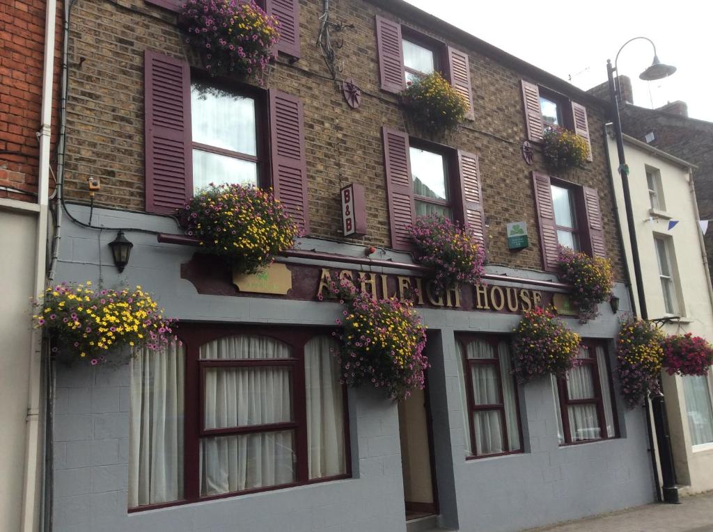 a building with windows and flower boxes on it at Ashleigh Guest House in Monaghan