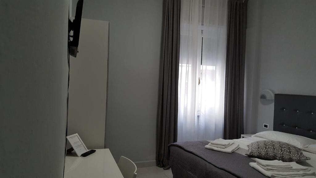 Postel nebo postele na pokoji v ubytování Hotel Milano