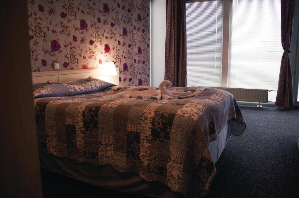 Postel nebo postele na pokoji v ubytování Hotell Tamula