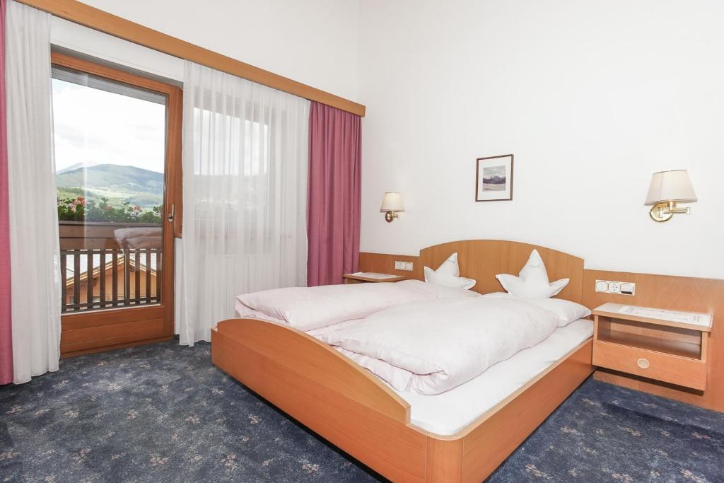 Postel nebo postele na pokoji v ubytování Hotel Waldheim