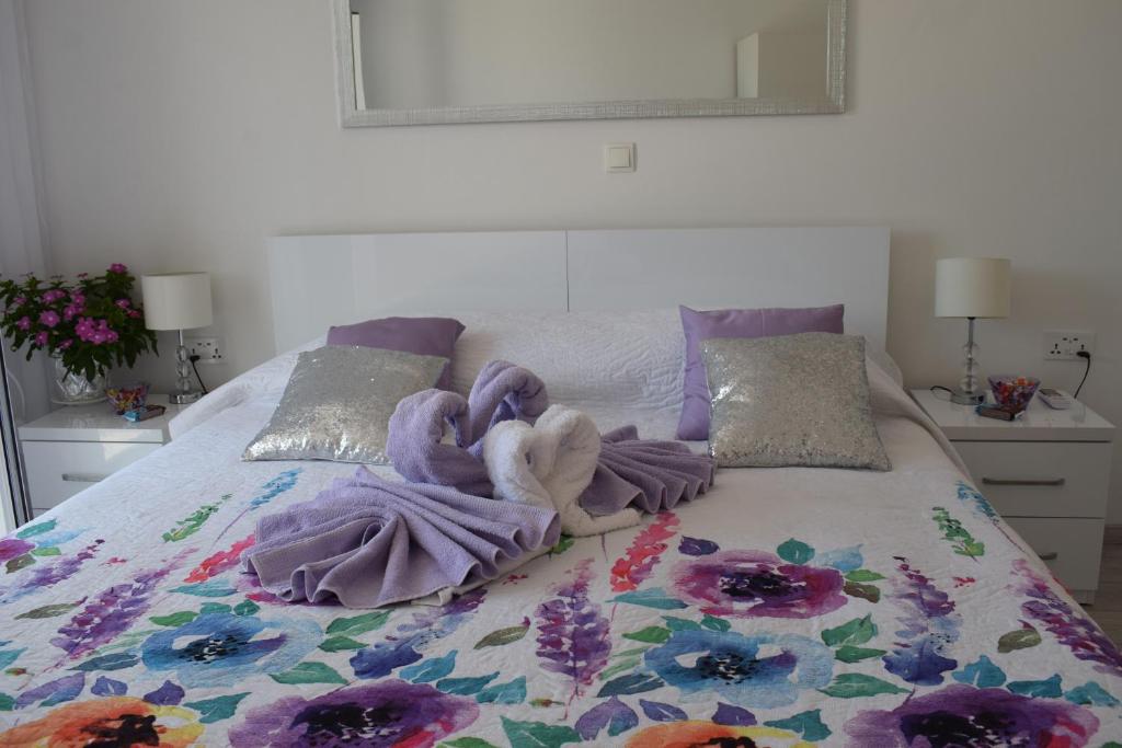 a bed with a blanket on top of it at Villa Zorana hostel in Hvar