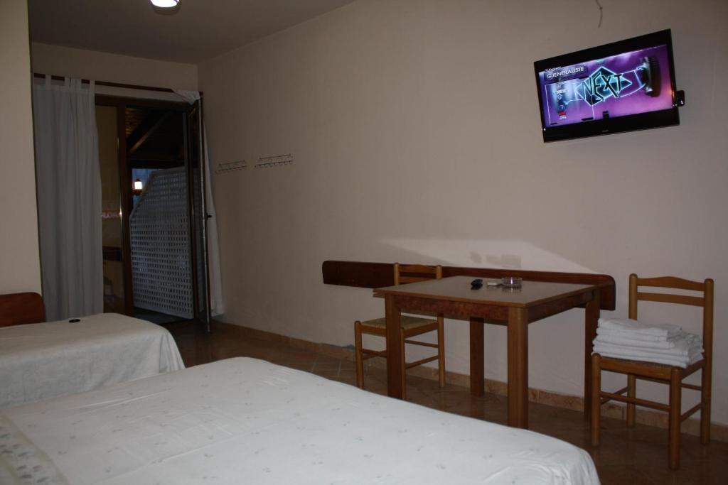 Postel nebo postele na pokoji v ubytování Hotel Martini