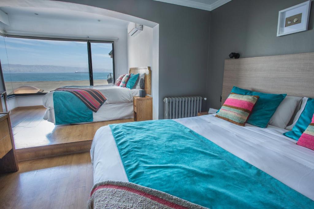 Uma cama ou camas num quarto em Hotel Oceanic