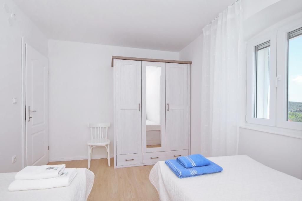 Postel nebo postele na pokoji v ubytování holiday home on DUGI OTOK - OTOK