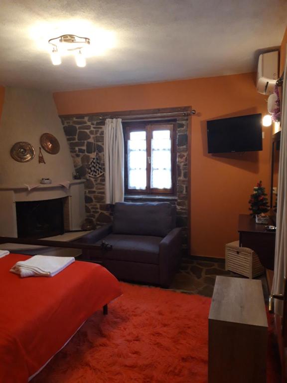 TV a/nebo společenská místnost v ubytování Guest House "Aspasia"