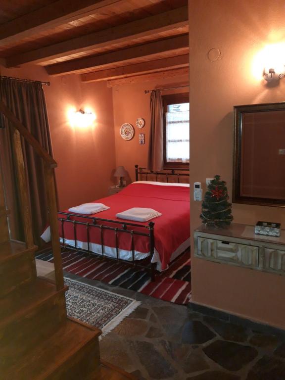 Postel nebo postele na pokoji v ubytování Guest House "Aspasia"