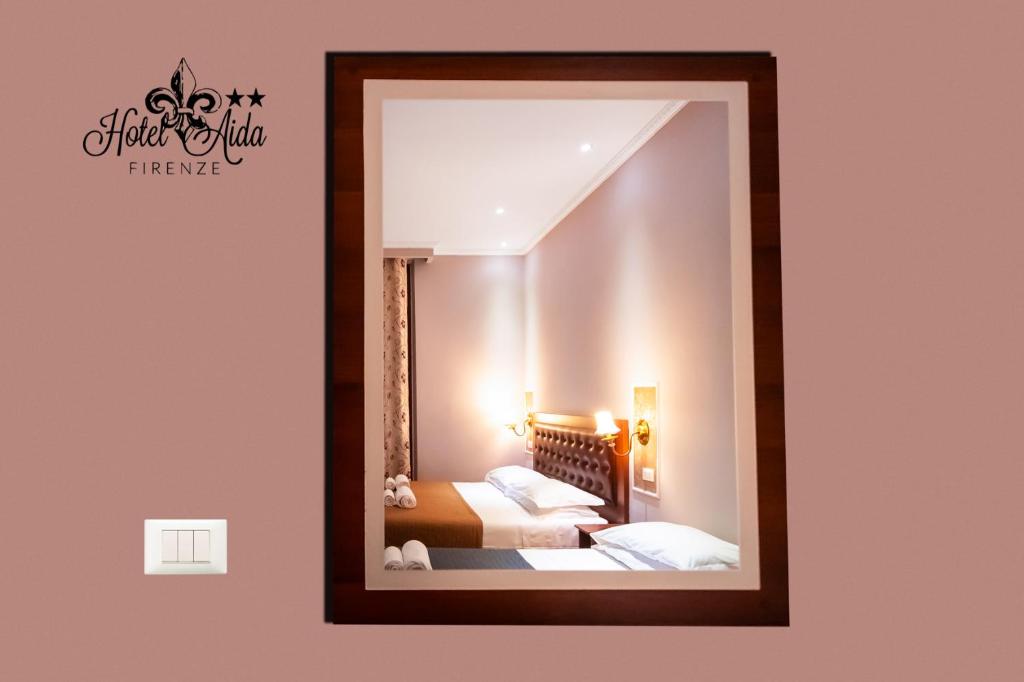 Postel nebo postele na pokoji v ubytování Hotel Aida