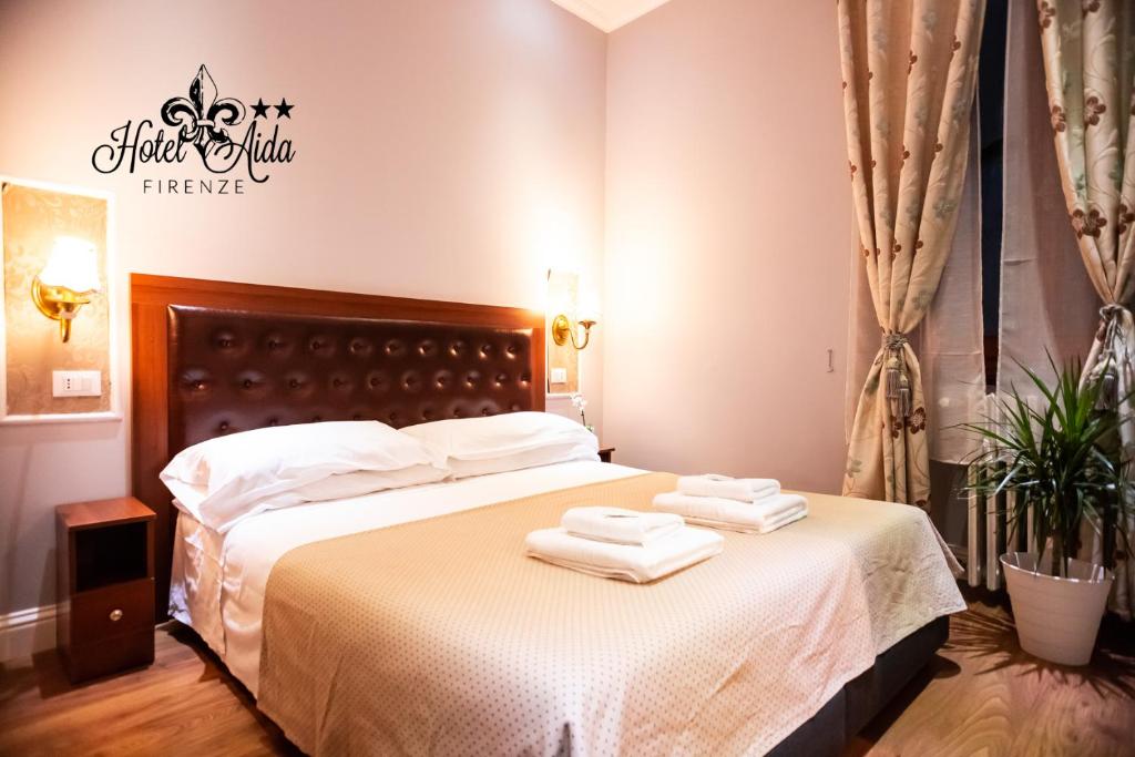 Postel nebo postele na pokoji v ubytování Hotel Aida