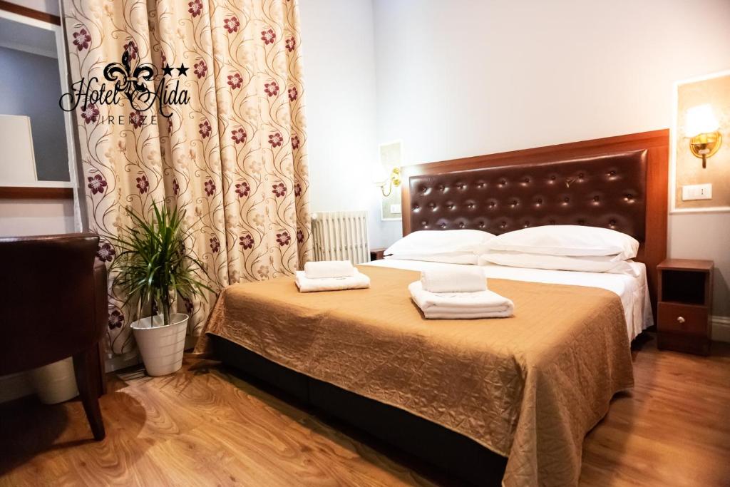 Postel nebo postele na pokoji v ubytování Hotel Aida