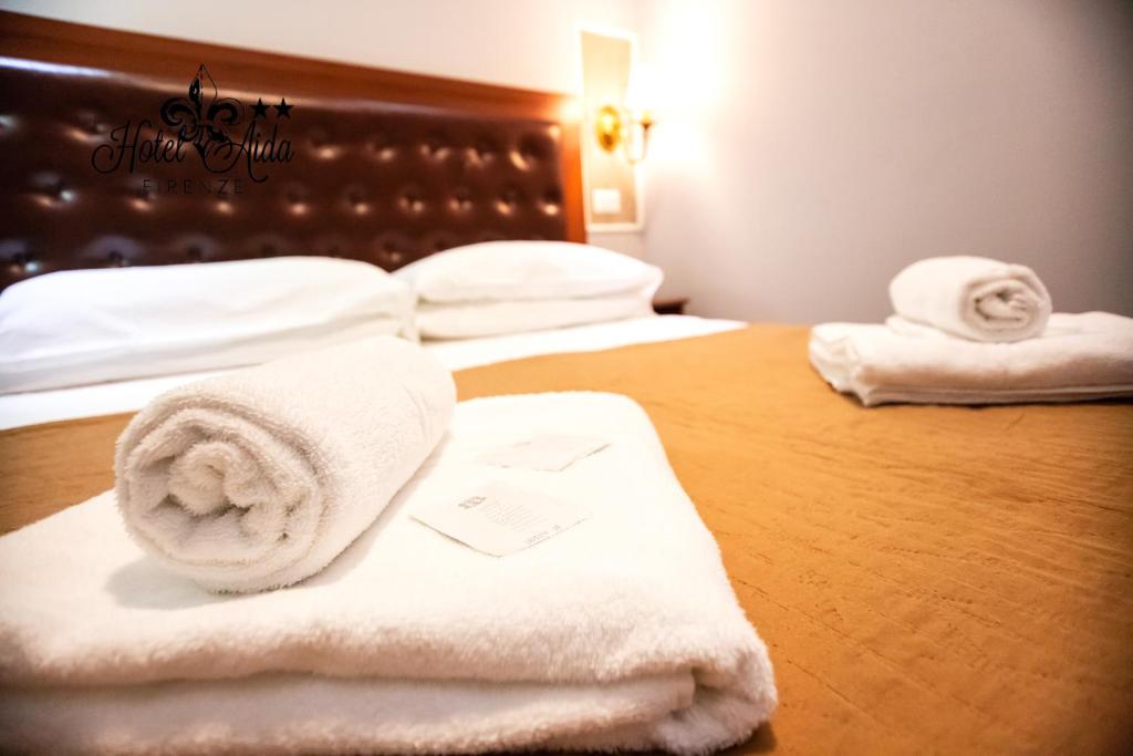 Postel nebo postele na pokoji v ubytování Hotel Aida
