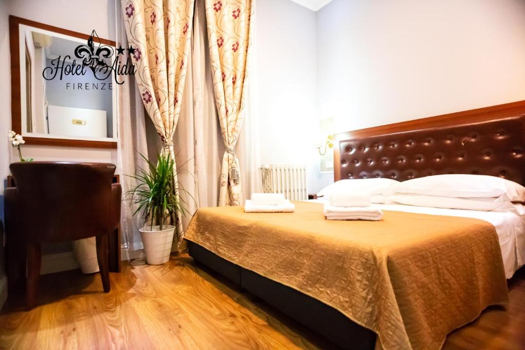 Postel nebo postele na pokoji v ubytování Hotel Aida