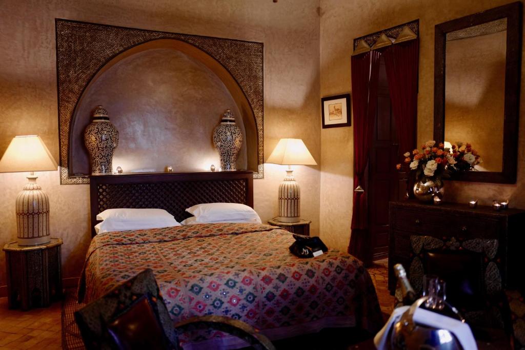 Postel nebo postele na pokoji v ubytování Riad Noir d'Ivoire