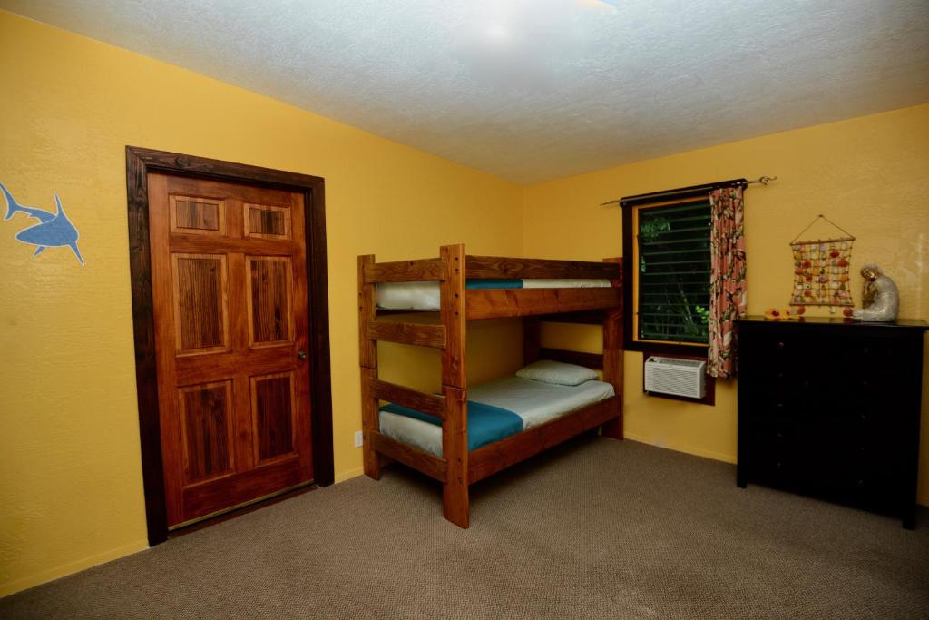 Postel nebo postele na pokoji v ubytování Kalani Hawaii Private Lodging