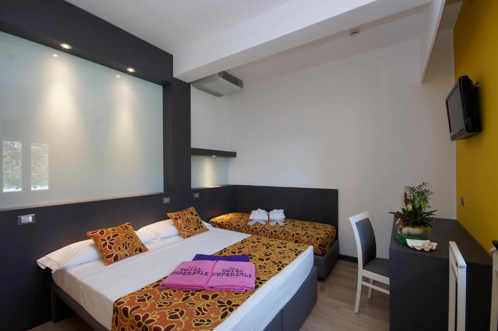 Postel nebo postele na pokoji v ubytování Hotel Imperiale & SPA