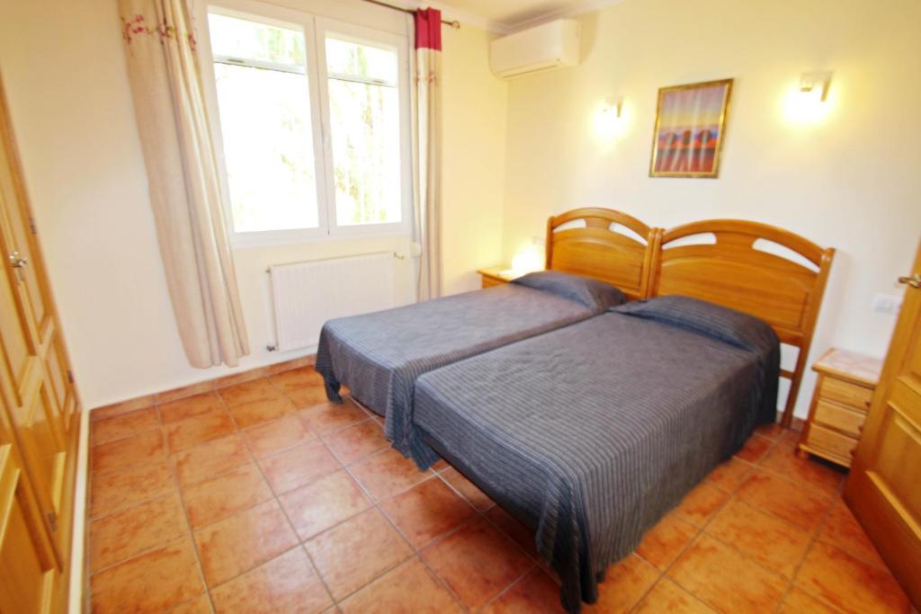 Posteľ alebo postele v izbe v ubytovaní Casa del Campo - sea view villa with private pool in Moraira