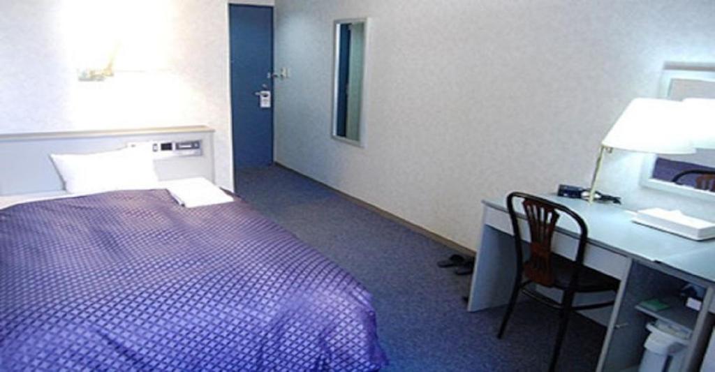 Krevet ili kreveti u jedinici u objektu Seagrande Shimizu Station Hotel / Vacation STAY 8197