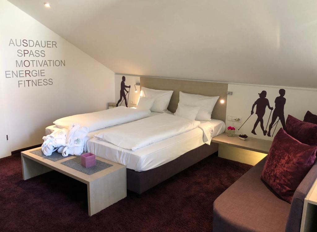 Postel nebo postele na pokoji v ubytování Boutique-Hotel im Weingarten