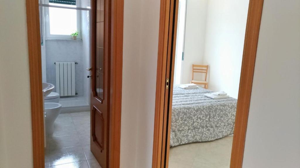 A bed or beds in a room at Il Soffione Home