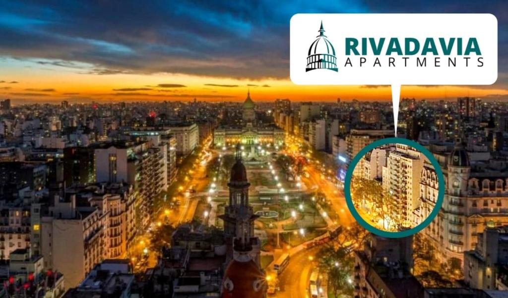 a view of a city at night with the rijeka apartments sign at Rivadavia Apartment in Buenos Aires