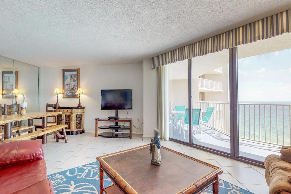 a living room with a view of the ocean at Dunes of Panama Condos in Panama City Beach