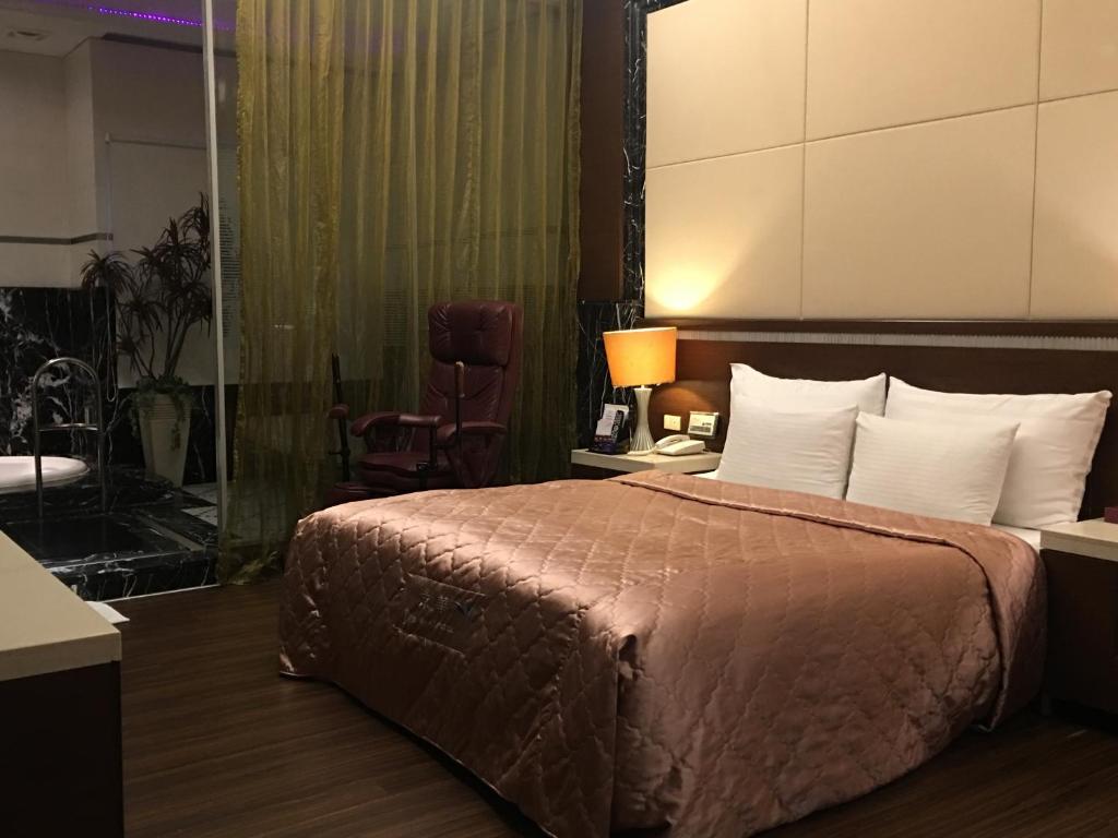 Postel nebo postele na pokoji v ubytování Jing Hwa Motel