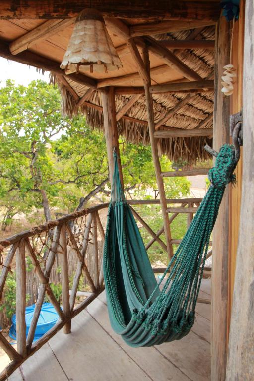 Raízes Eco Hostelにあるバルコニーまたはテラス