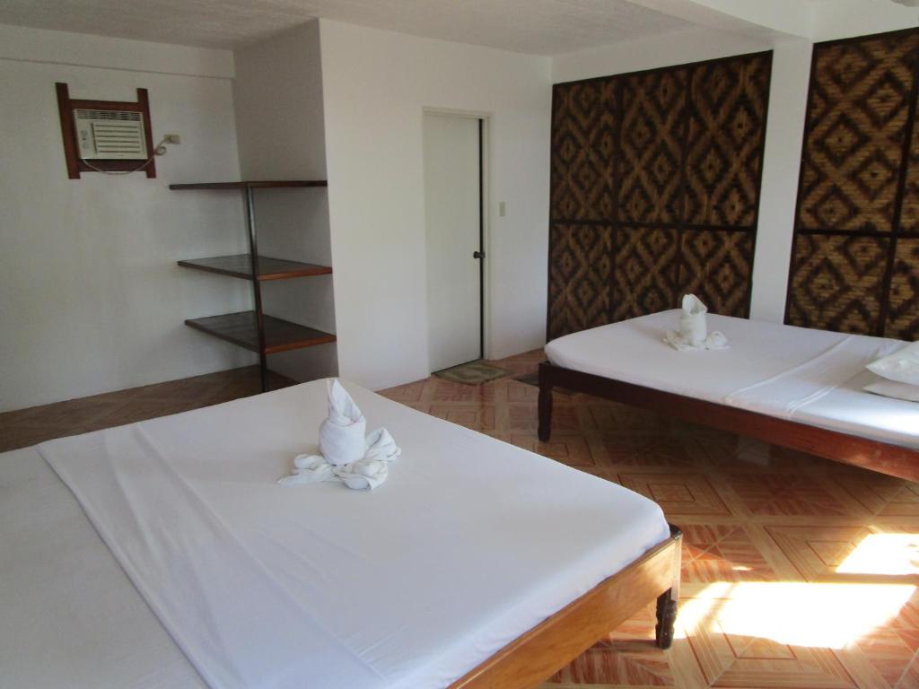 Postel nebo postele na pokoji v ubytování Point 303 Resort
