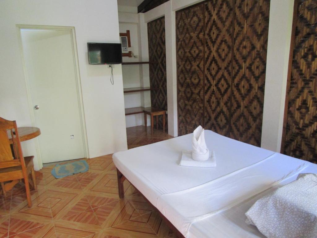 Postel nebo postele na pokoji v ubytování Point 303 Resort