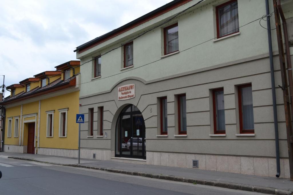 a building on the side of a street at Althann Vendégház és Konferencia Központ in Vác
