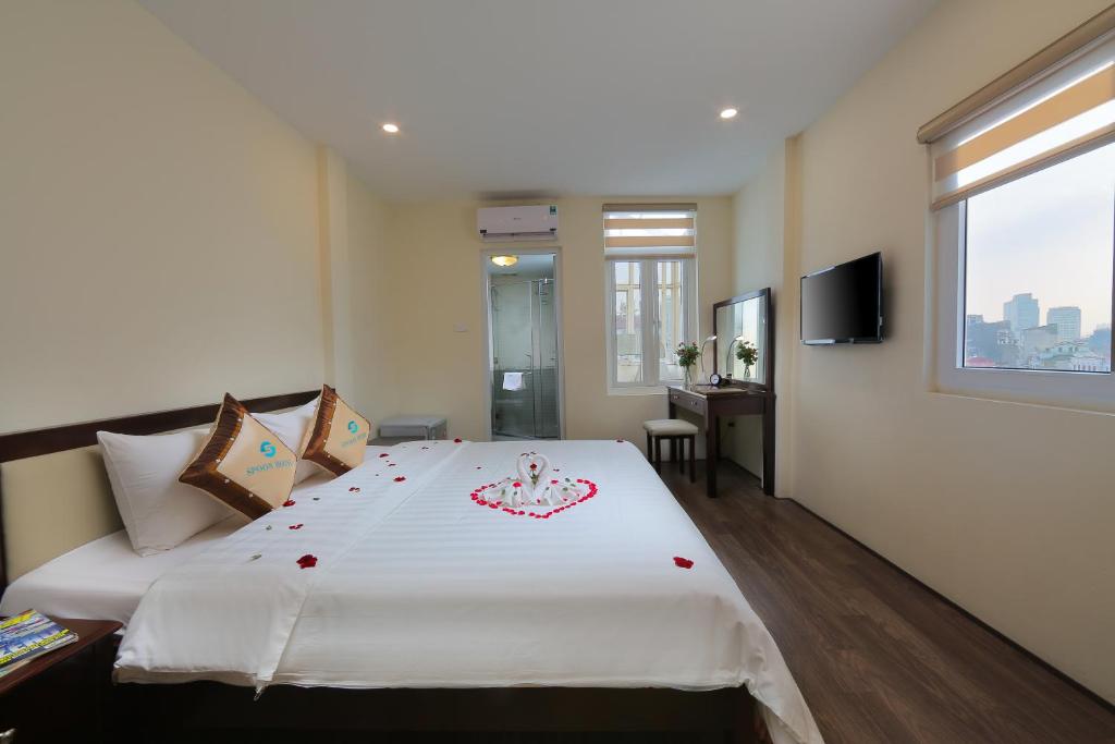 Postel nebo postele na pokoji v ubytování Spoon Hotel