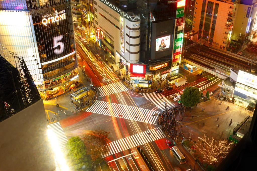 a city street at night with tall buildings at Shibuya Excel Hotel Tokyu in Tokyo