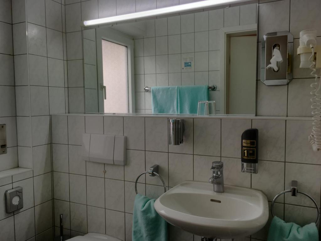Koupelna v ubytování Hotel Hansa