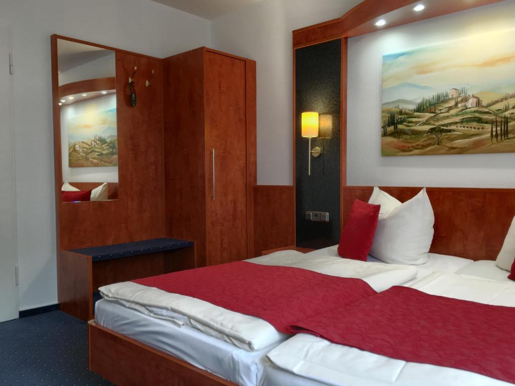Postel nebo postele na pokoji v ubytování Hotel Hansa