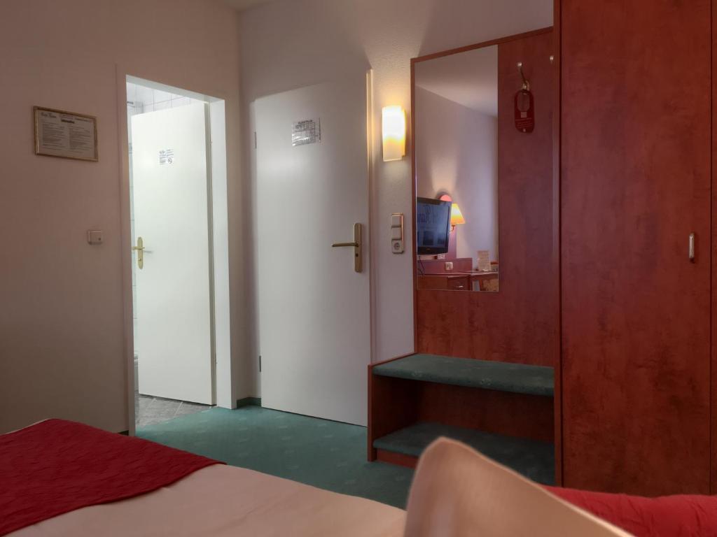 Postel nebo postele na pokoji v ubytování Hotel Hansa