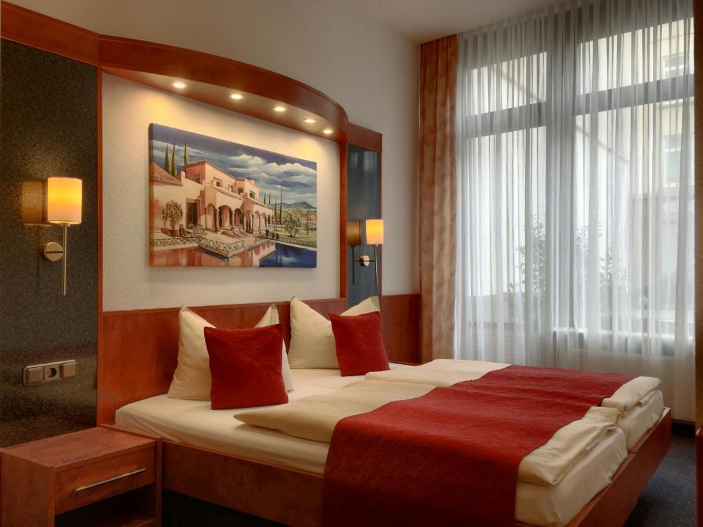 Postel nebo postele na pokoji v ubytování Hotel Hansa