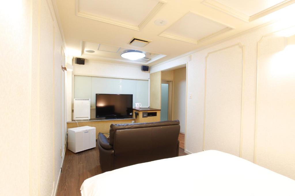 Postel nebo postele na pokoji v ubytování Hotel Mio (Adult Only)