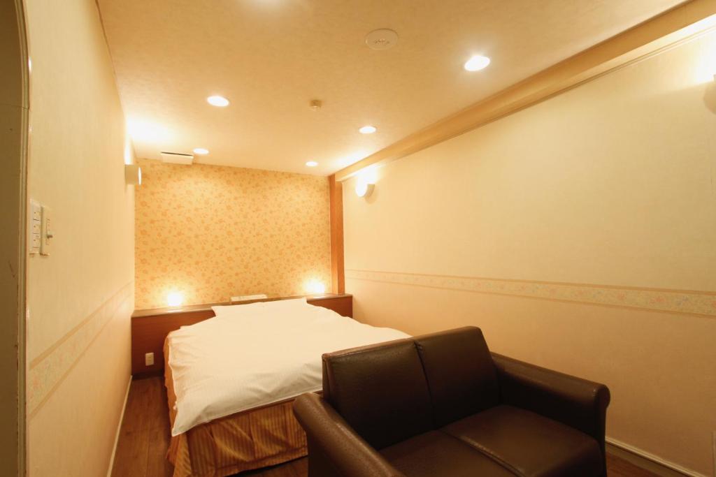 Postel nebo postele na pokoji v ubytování Hotel Mio (Adult Only)
